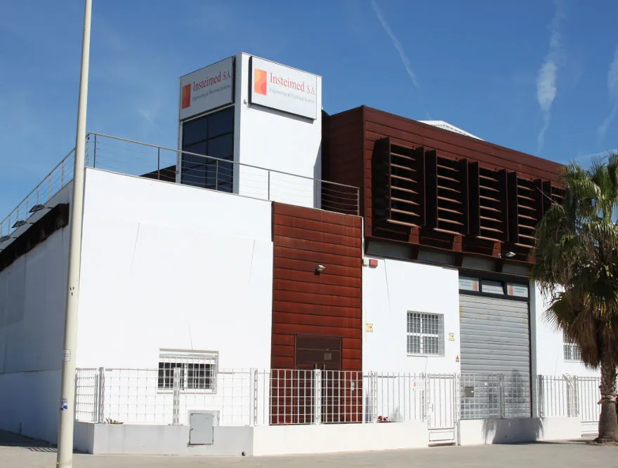 Front facade of the Insteimed building, with the company sign, in Paiporta, Valencia